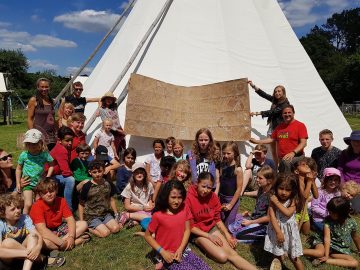 Really Wild Home Education Gathering Group Photo. Lots of children from all walks of life coming together at the Wild Festival to share their skills and have great fun in the sun.